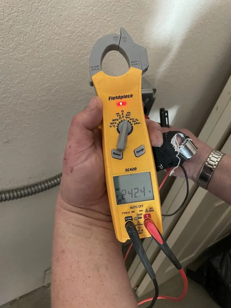 Voltage testing with clamp meter during Ceiling Fan Installation in South Berwick